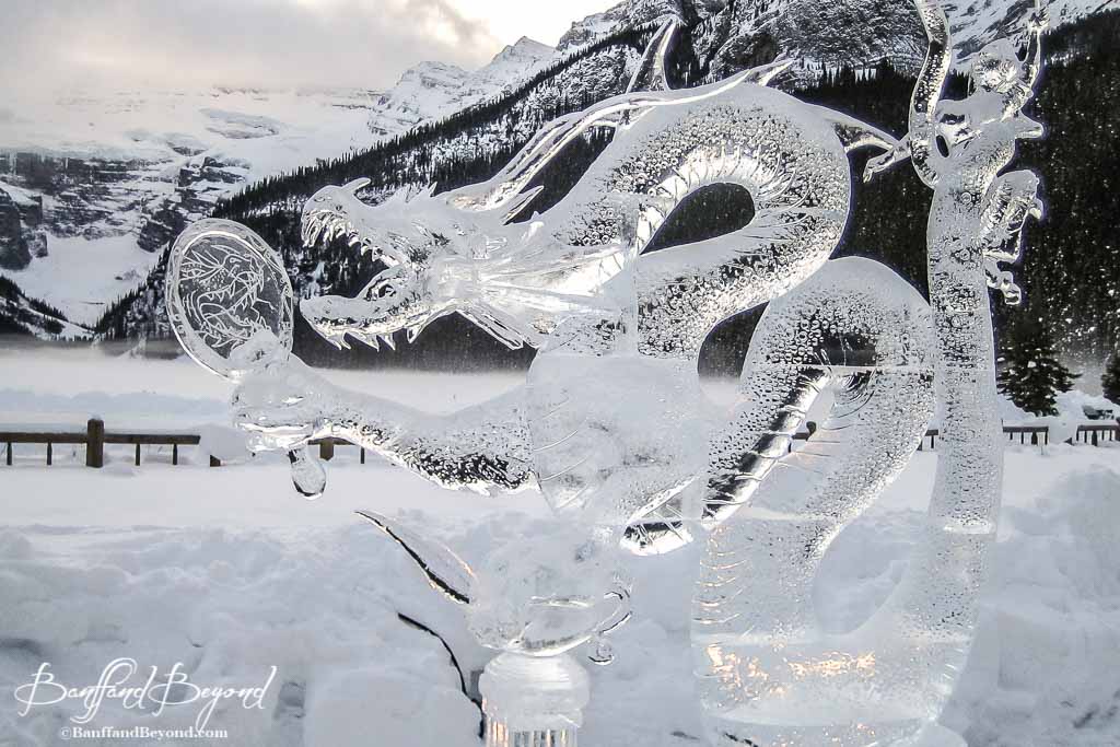 dragon ice sculpture holding a mirror at lake louise ice magic festival