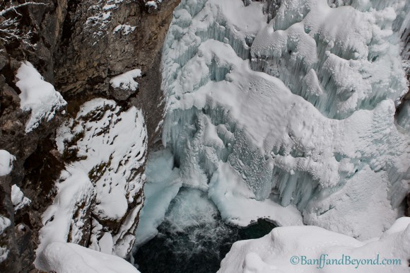 view of frozen upper falls in johnston canyon covered in hanging ice