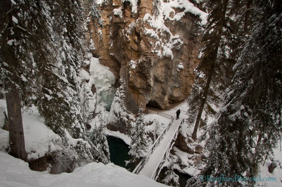 winter view looking down at catwalk leading to lower falls in johnston canyon