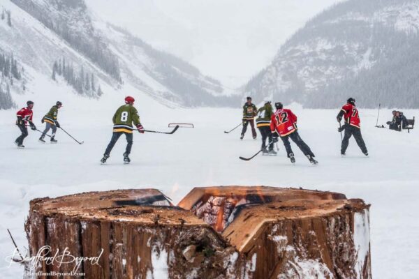 lake louise pond hockey classic players on ice
