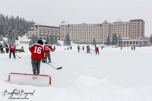 players on the ice at lake louise pond hockey classic