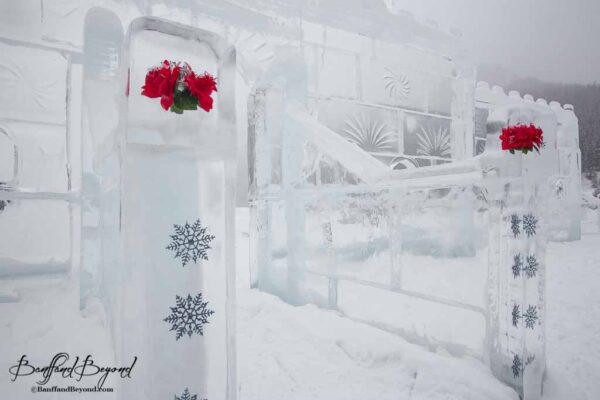 roses in ice castle sculpture at lake louise
