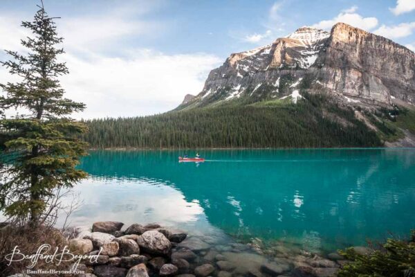 one canoe in solitude on tuquiose waters of lake louise