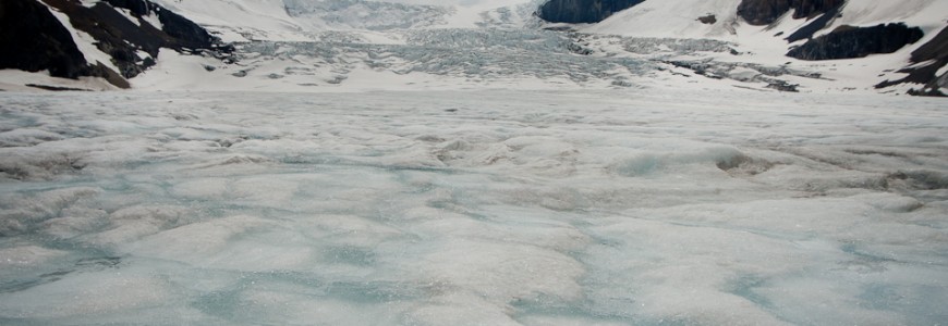 blue coloured frozen ice of the athabasca glacier