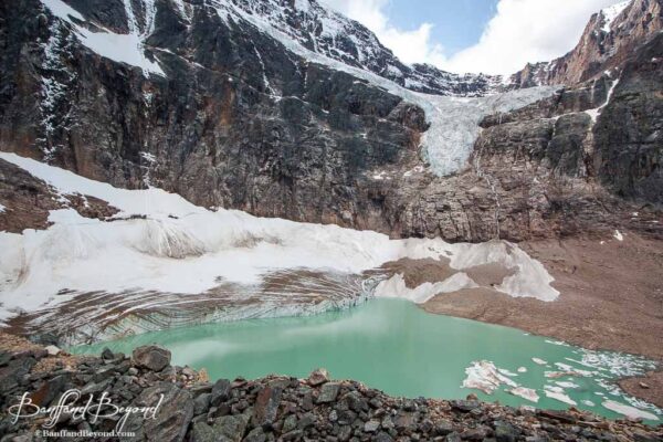 green water of cavell pond at edith cavell mountain in jasper