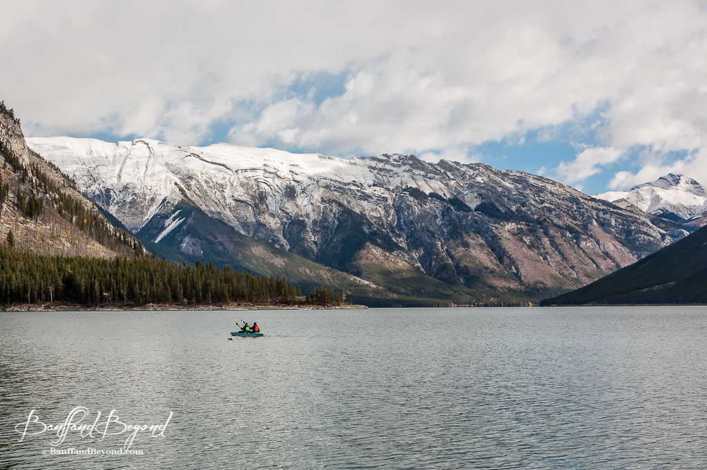 Two people in a kayak on Lake Minnewanka in Banff National Park